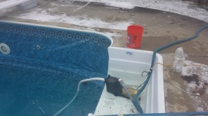 Draining icey pool to patch